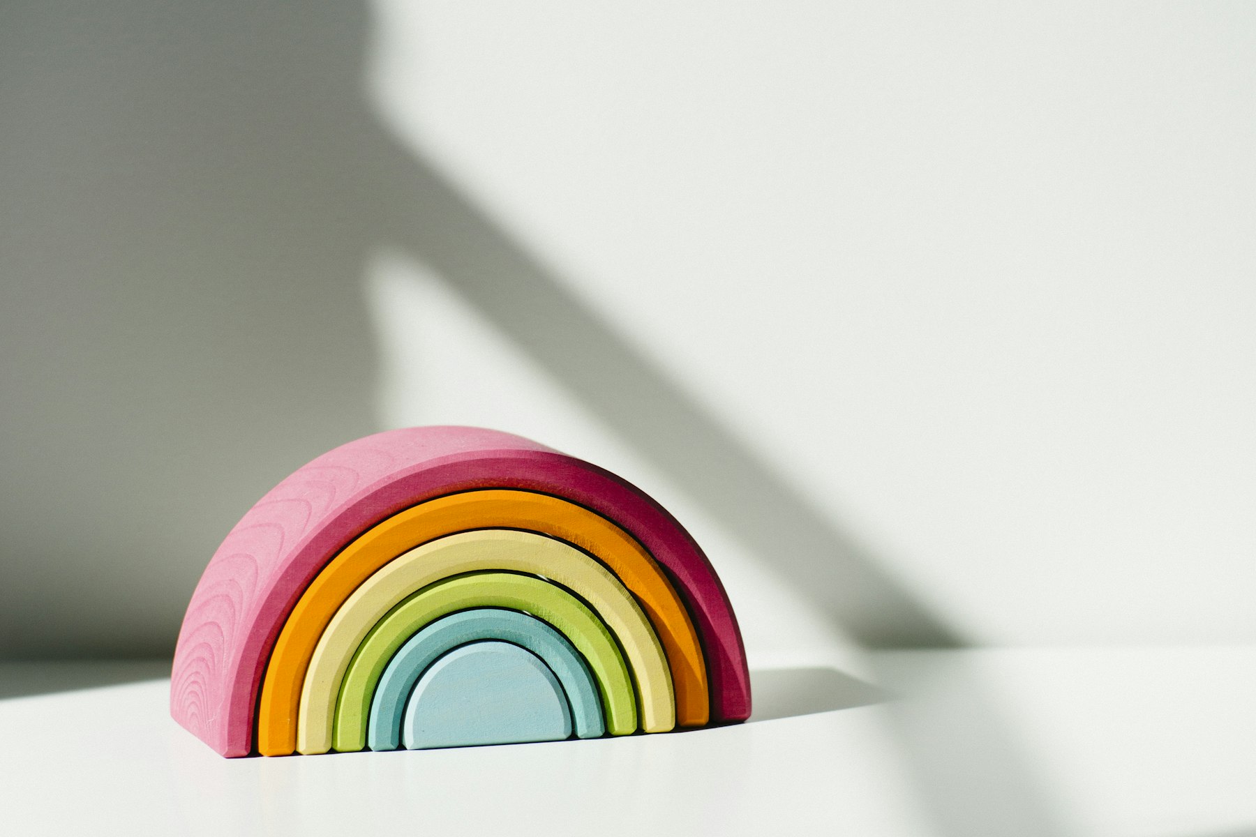 Kids Yoga 2 (Unsplash) Pastel wooden rainbow toy